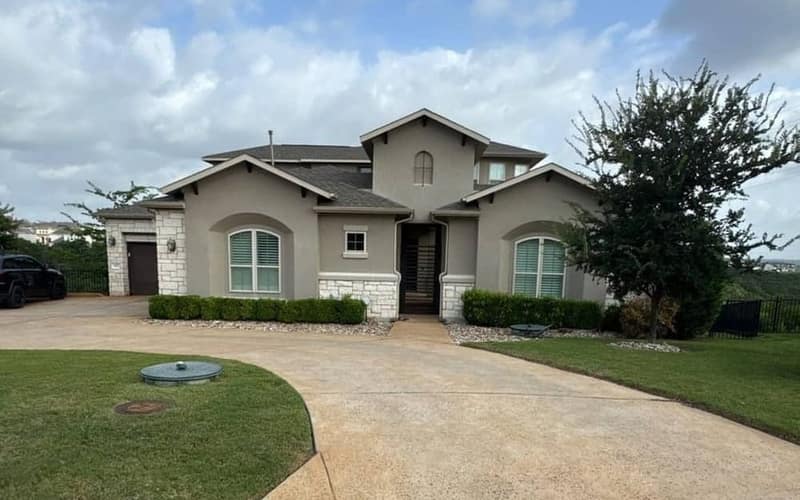 A Lakeway house with its original gray asphalt shingle roof